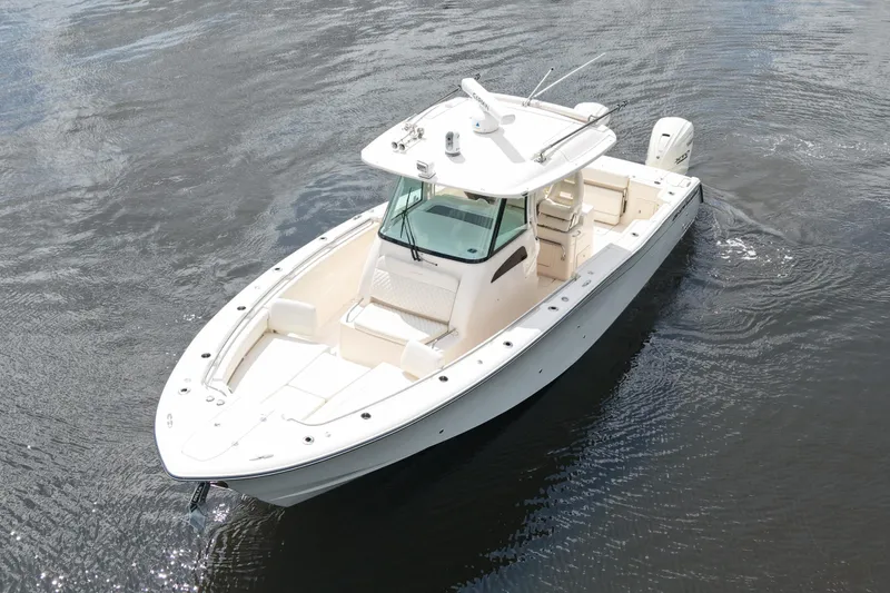 Slide: The Image of 2024 Grady-White Canyon 336 boat on calm water, aerial view. - 10