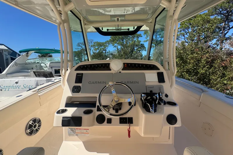 Slide: The Image of 2024 Grady-White Canyon 336 helm with Garmin navigation, sleek design, and modern controls. - 27