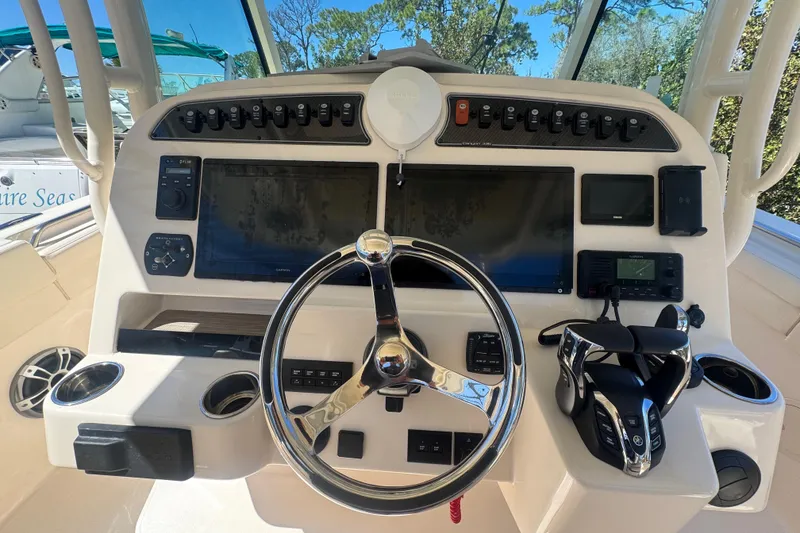 Slide: The Image of 2024 Grady-White Canyon 336 helm with advanced navigation and control systems. - 28