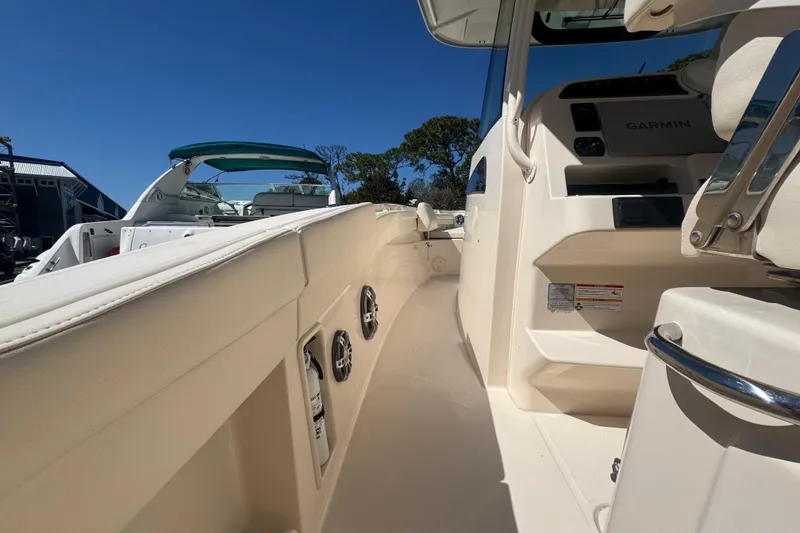 Slide: The Image of 2024 Grady-White Canyon 336 boat interior with Garmin navigation system. - 29