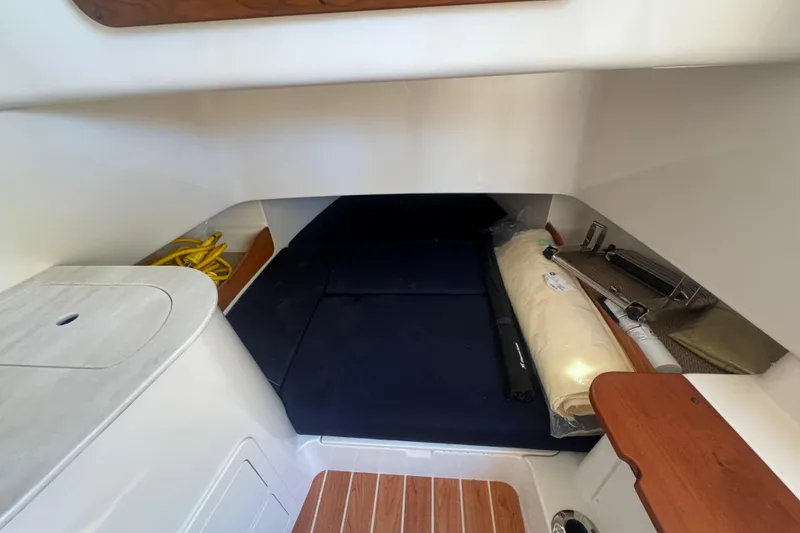 Slide: The Image of 2024 Grady-White Canyon 336 cabin interior with storage and seating area. - 35