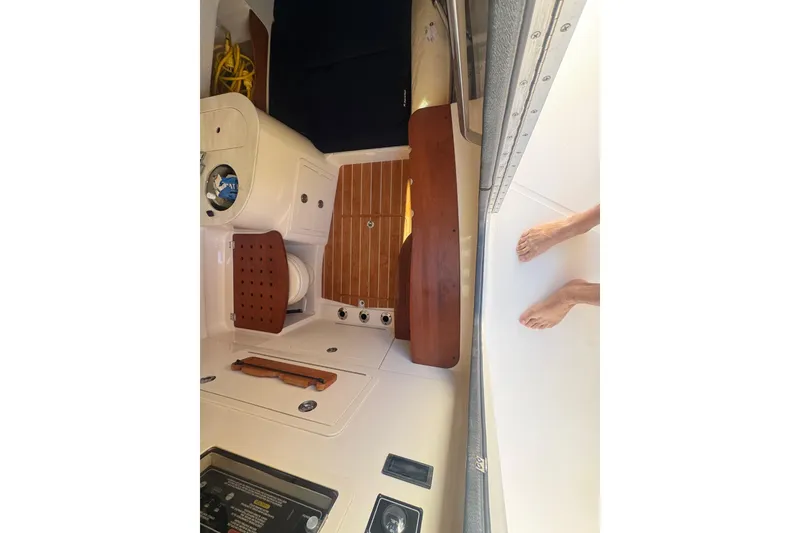 Slide: The Image of 2024 Grady-White Canyon 336 boat interior with teak flooring and control panel. - 38