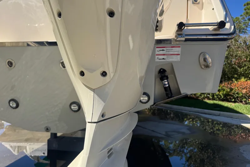 Slide: The Image of 2024 Grady-White Canyon 336 boat stern and engine detail in sunlight. - 42