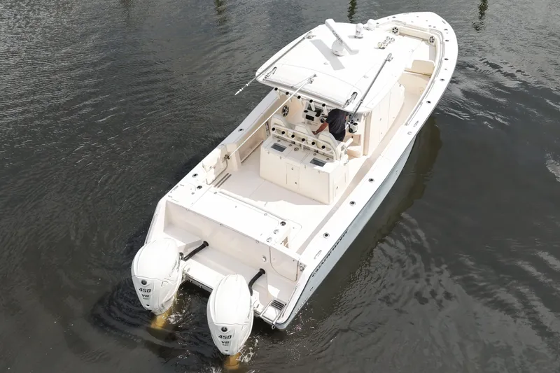 Slide: The Image of 2024 Grady-White Canyon 336 boat with dual engines on water. - 6