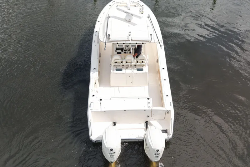 Slide: The Image of 2024 Grady-White Canyon 336 boat on water, aerial view. - 8