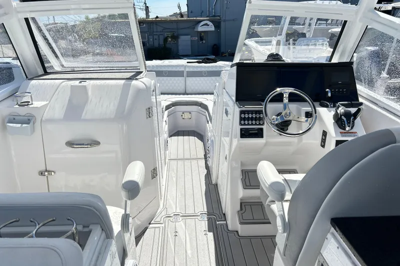 Slide: The Image of 2025 Sea Fox 288 Traveler boat interior with modern helm and seating. - 10