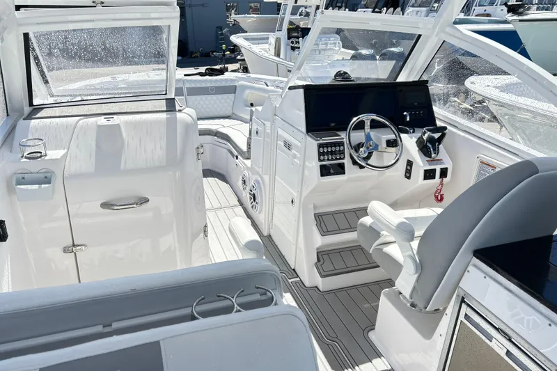 Slide: The Image of 2025 Sea Fox 288 Traveler boat interior with modern helm and seating. - 11