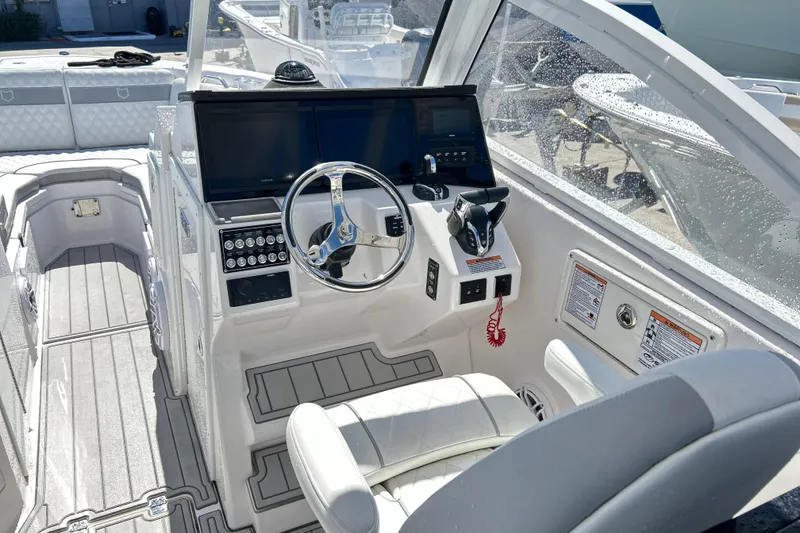 Slide: The Image of 2025 Sea Fox 288 Traveler boat cockpit with modern steering and controls. - 13