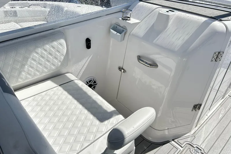 Slide: The Image of Interior of 2025 Sea Fox 288 Traveler boat with white seating and storage compartment. - 14