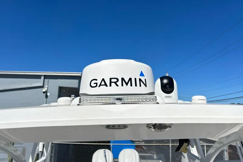 Slide: The Image of Garmin equipment on 2025 Sea Fox 288 Traveler boat against clear blue sky. - 15