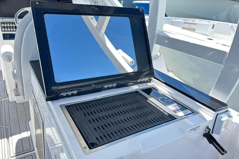 Slide: The Image of 2025 Sea Fox 288 Traveler boat grill and prep station with reflective cover. - 17