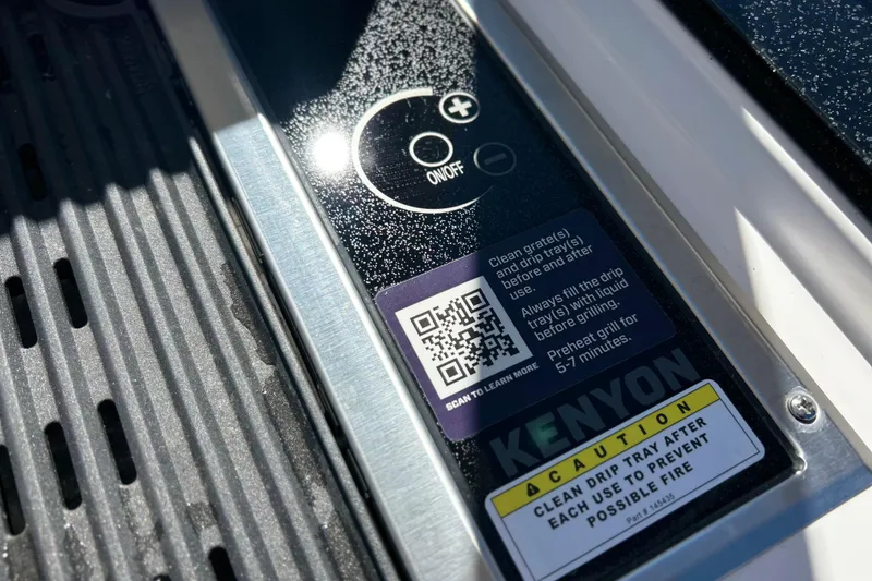 Slide: The Image of Control panel of a 2025 Sea Fox 288 Traveler boat grill with caution labels. - 18