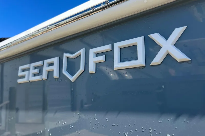 Slide: The Image of Close-up of 2025 Sea Fox 288 Traveler boat logo on hull. - 26