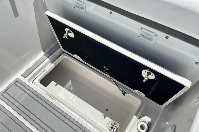 Slide: The Image of Open storage compartment on a 2026 Sea Fox 288 Traveler boat. - 29