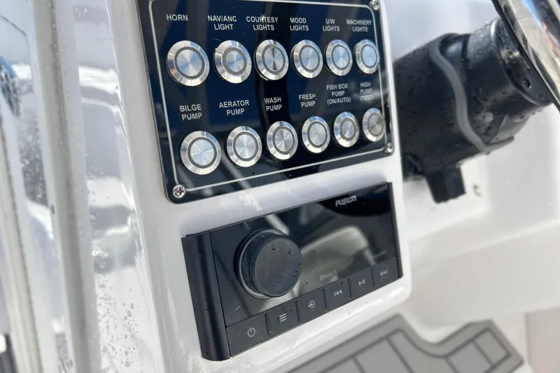 Slide: The Image of Control panel of 2025 Sea Fox 288 Traveler boat with various function buttons. - 3