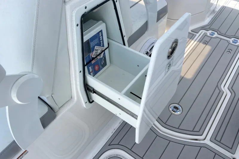 Slide: The Image of Storage compartment on 2026 Sea Fox 288 Traveler boat, featuring a pull-out drawer. - 30