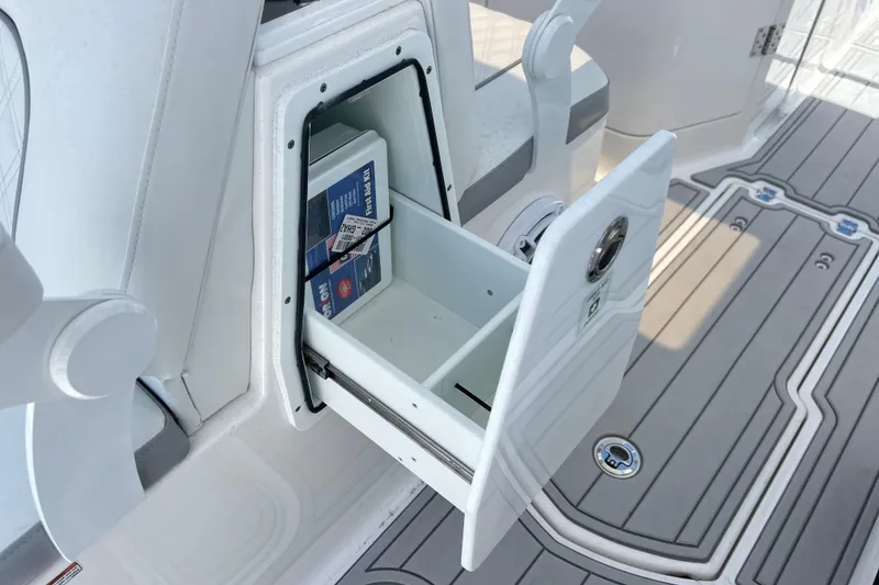 Slide: The Image of Storage compartment on 2026 Sea Fox 288 Traveler boat with open drawer and manual. - 31