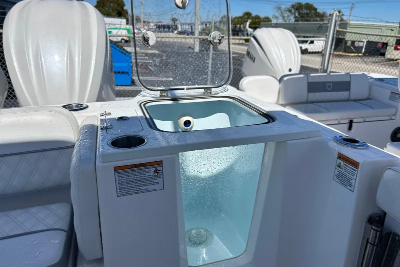 Slide: The Image of 2025 Sea Fox 288 Traveler boat interior with livewell and seating area. - 5