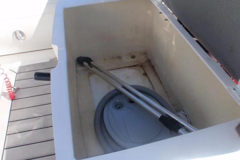 Slide: The Image of Storage compartment of 2021 Gala A300L boat with hose and handle inside. - 4