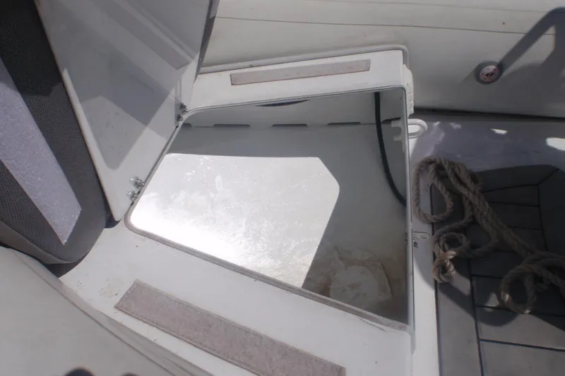 Slide: The Image of Open storage compartment on a 2021 Gala A300L boat with rope inside. - 6