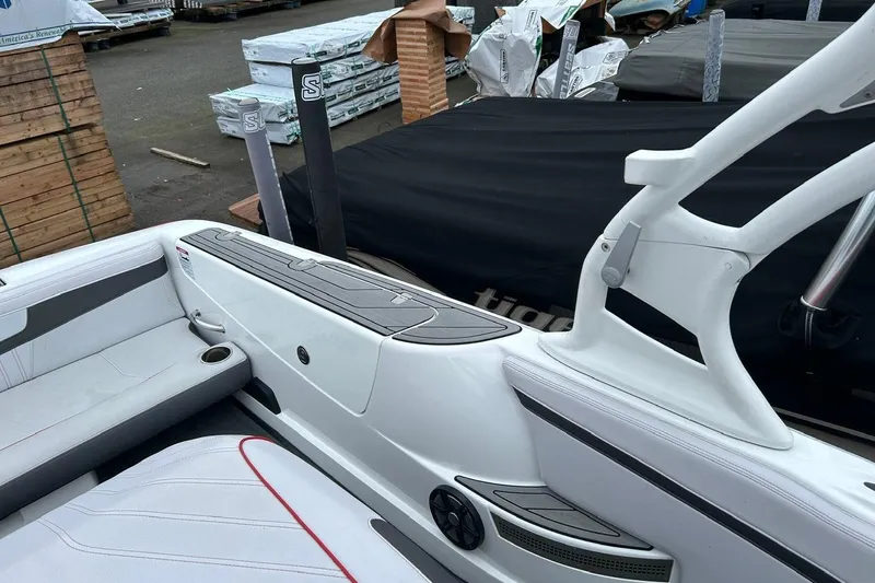 Slide: The Image of 2017 Nautique Ski Nautique 200 Open Bow interior with seating and storage. - 12