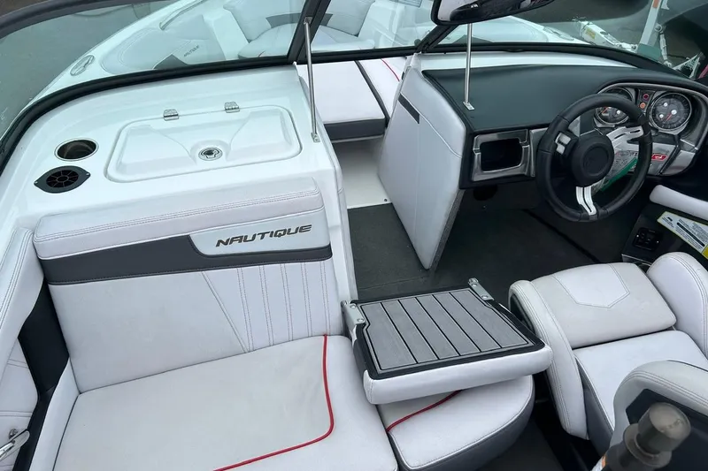 Slide: The Image of 2017 Nautique Ski Nautique 200 Open Bow interior with sleek design and modern dashboard. - 14