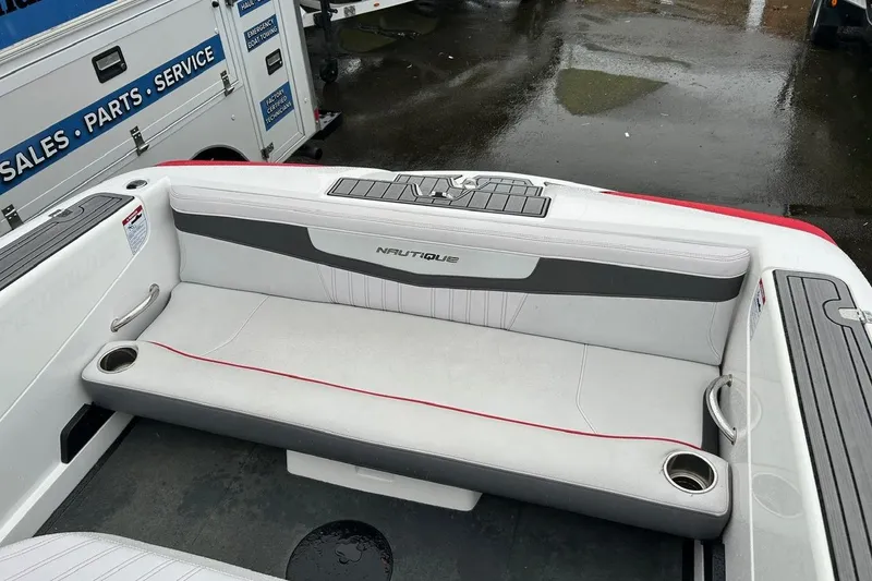 Slide: The Image of 2017 Nautique Ski Nautique 200 Open Bow interior with gray seating and cup holders. - 15