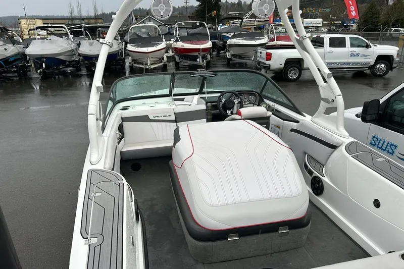 Slide: The Image of 2017 Nautique Ski Nautique 200 Open Bow boat interior at a dealership lot. - 16