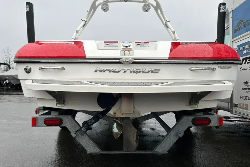 Slide: The Image of 2017 Nautique Ski Nautique 200 Open Bow boat on trailer, rear view. - 20