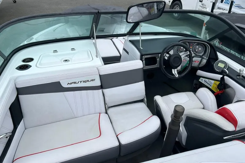 Slide: The Image of 2017 Nautique Ski Nautique 200 Open Bow interior with steering wheel and seating. - 6