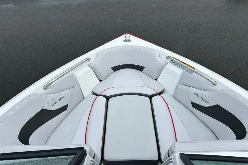 Slide: The Image of 2017 Nautique Ski Nautique 200 Open Bow with white and black seating. - 8
