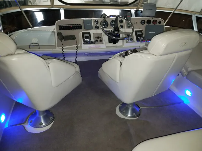 Slide: The Image of Interior of a 2001 Regal 3780 boat with blue lighting. - 5
