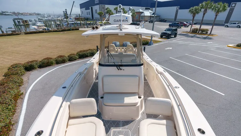Slide: The Image of 2022 Grady-White Canyon 306 boat parked at marina. - 10
