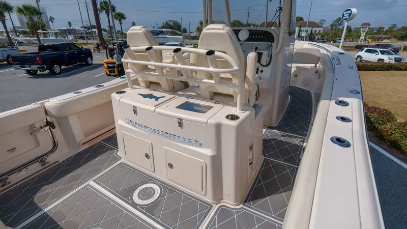 Slide: The Image of 2022 Grady-White Canyon 306 boat with spacious deck and seating area. - 30