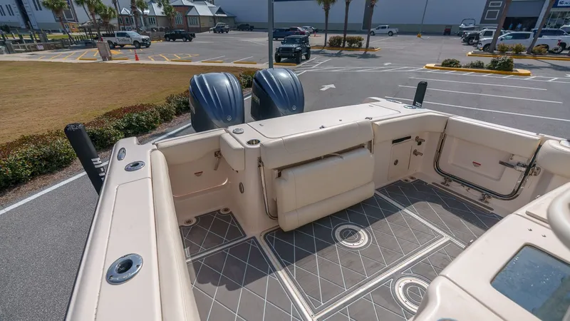 Slide: The Image of Grady-White Canyon 306 boat, 2022 model, in parking lot with twin outboard engines. - 31