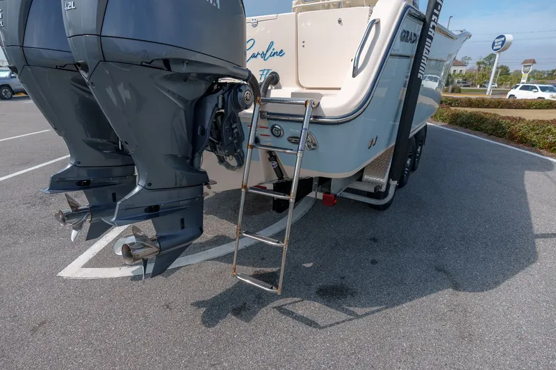 Slide: The Image of 2022 Grady-White Canyon 306 boat with dual engines and ladder. - 36