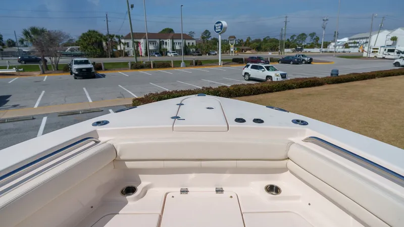 Slide: The Image of Grady-White Canyon 306 boat 2022 on parking lot, front view. - 4