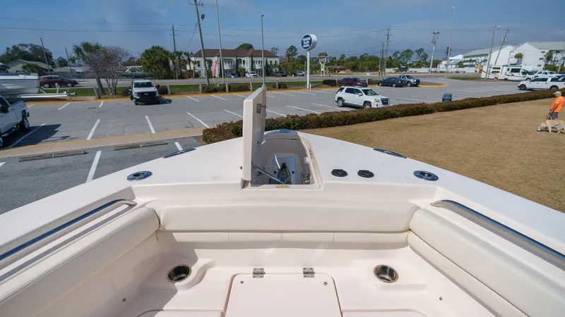 Slide: The Image of Grady-White Canyon 306 boat 2022 in parking lot, front view. - 5