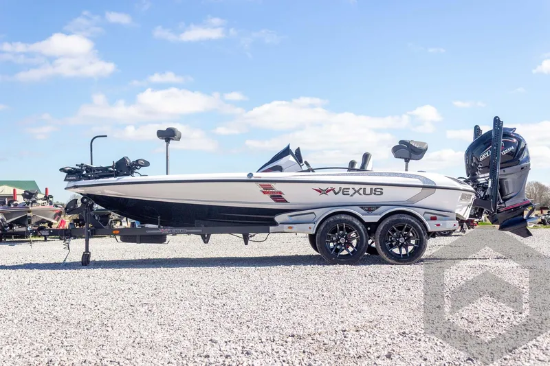 Slide: The Image of 2026 Vexus VXs20 boat on trailer, parked on gravel, under clear blue sky. - 12