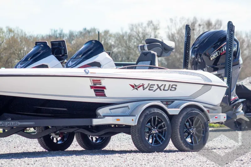 Slide: The Image of 2026 Vexus VXs20 boat on trailer, featuring sleek design and powerful engine. - 2