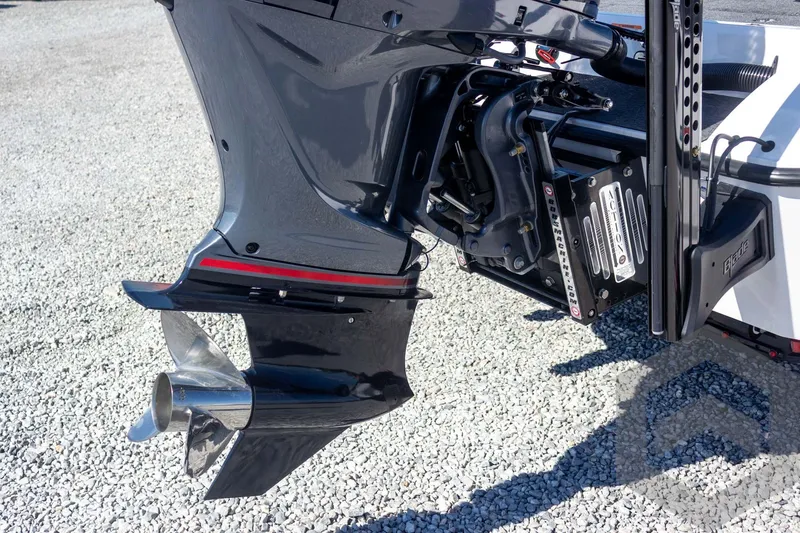 Slide: The Image of 2026 Vexus VXs20 boat motor and propeller on gravel surface. - 22