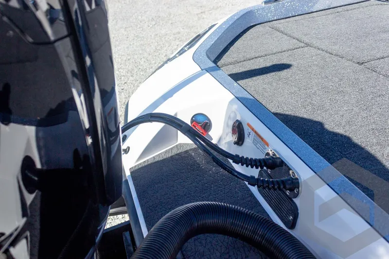 Slide: The Image of 2026 Vexus VXs20 boat deck with engine cables and control panel. - 24