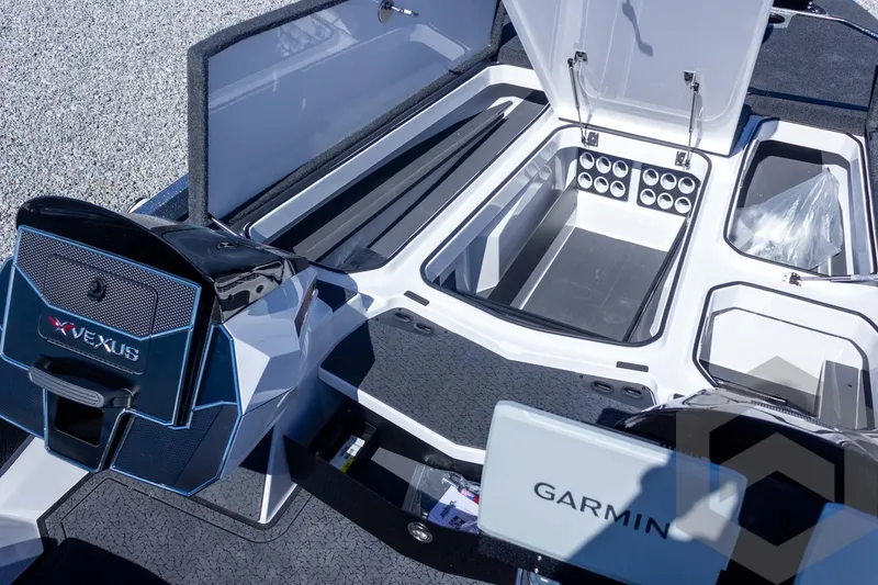 Slide: The Image of 2026 Vexus VXs20 boat interior with storage compartments and Garmin equipment. - 29