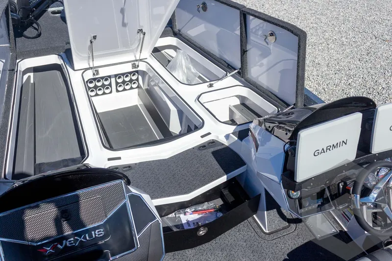 Slide: The Image of 2026 Vexus VXs20 boat interior with storage compartments and Garmin displays. - 30