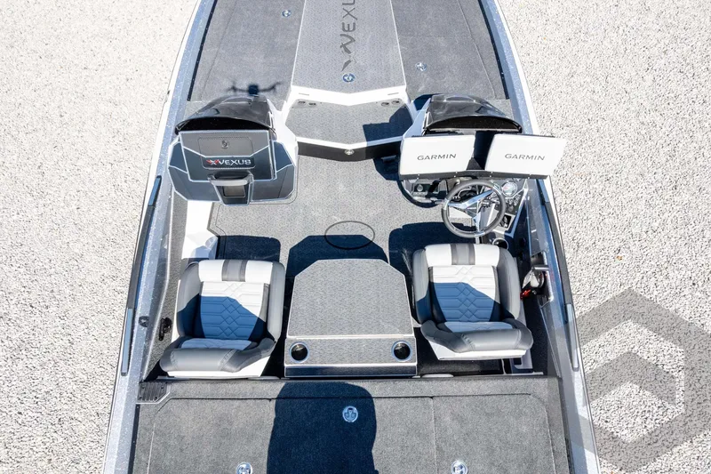 Slide: The Image of 2026 Vexus VXs20 boat interior with dual Garmin displays and stylish seating. - 56