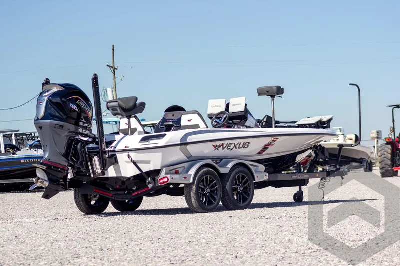 Slide: The Image of 2026 Vexus VXs20 boat on trailer, featuring Yamaha outboard motor, parked on gravel. - 6
