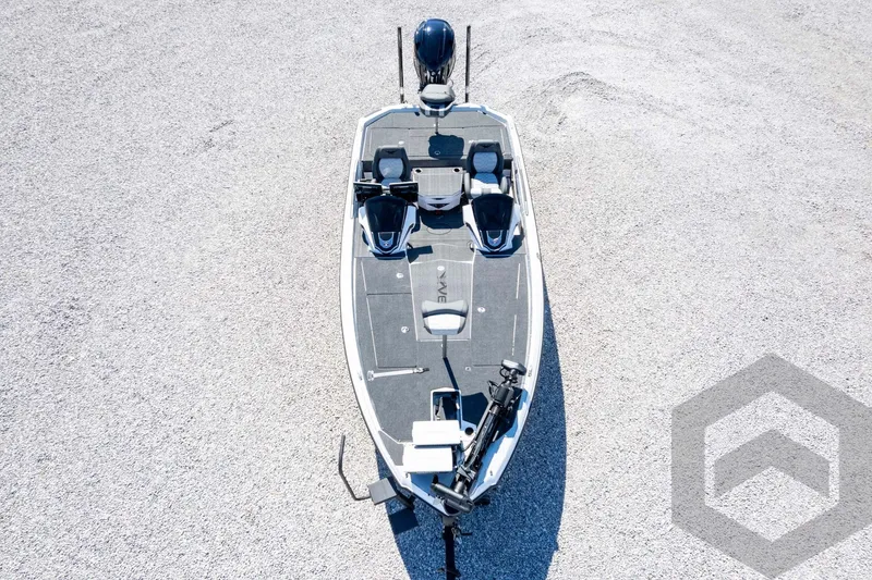 Slide: The Image of 2026 Vexus VXs20 boat on gravel, top view, showcasing sleek design and modern features. - 64