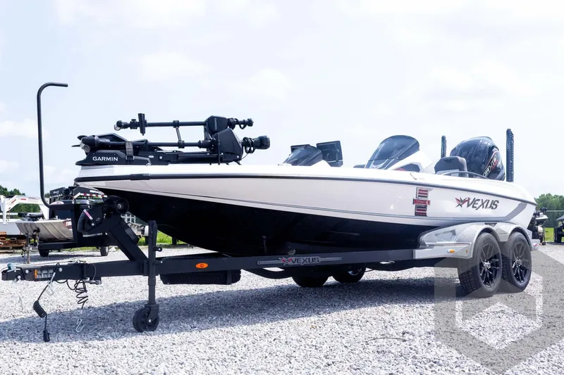 Slide: The Image of 2026 Vexus VXs20 boat on trailer, featuring Garmin equipment, parked on gravel. - 68