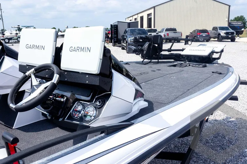 Slide: The Image of 2026 Vexus VXs20 boat with Garmin electronics, steering wheel, and spacious deck. - 71