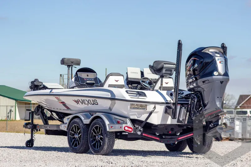 Slide: The Image of 2026 Vexus VXs20 boat with Yamaha engine, dual axles, and Garmin electronics on a trailer. - 9